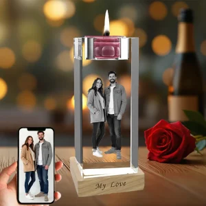 A personalized crystal candlestick holder with a 3D engraved photo of a couple inside. The wooden base is engraved with "My Love" and a candle is lit on top, creating a romantic anniversary gift.