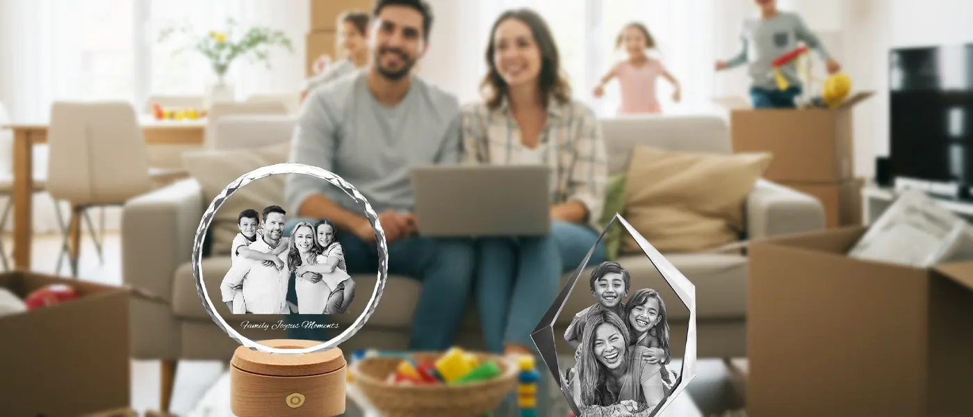 A collection of personalized 3D photo crystal gifts featuring family portraits, set against the backdrop of a happy family unpacking boxes in their new living room.
