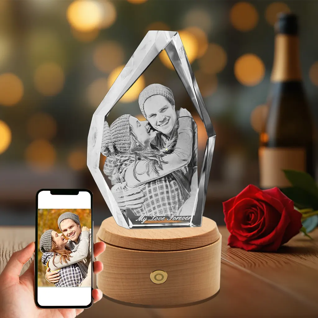 A unique iceberg-shaped 3D photo crystal, engraved with a sweet couple's portrait and the text "My Love Forever," set on a luminous rotating wood base as a special anniversary gift.