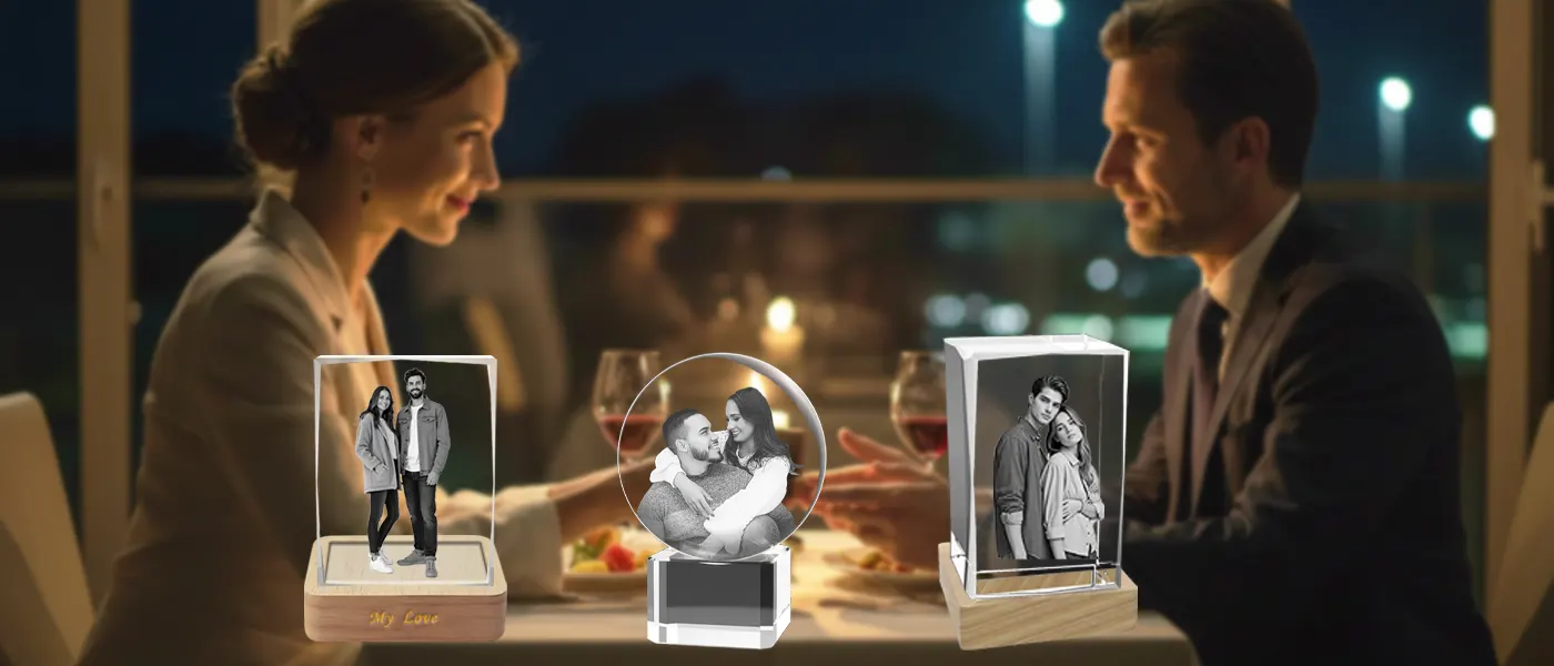 A collection of personalized 3D photo crystal gifts featuring couple portraits, set on a table during a romantic anniversary dinner for a husband and wife.