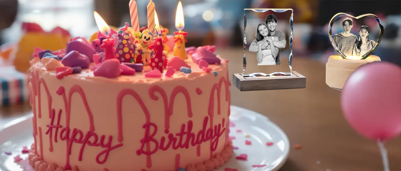 A festive birthday party scene featuring a colorful 'Happy Birthday' cake with lit candles, alongside two personalized 3D photo crystal gifts for the celebration.