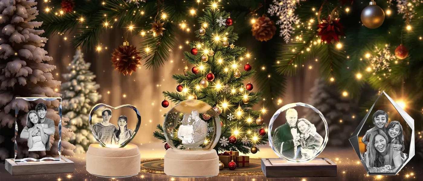 A festive collection of personalized 3D photo crystal gifts, featuring cherished family photos, arranged in front of a magical, illuminated Christmas tree with sparkling lights.