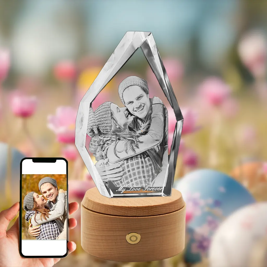A 3D photo of a happy couple is engraved in a faceted, iceberg-shaped crystal with "My Love Forever" text. It sits on a wooden rotating LED base against a festive Easter background of flowers and eggs, with a phone showing the original photo.