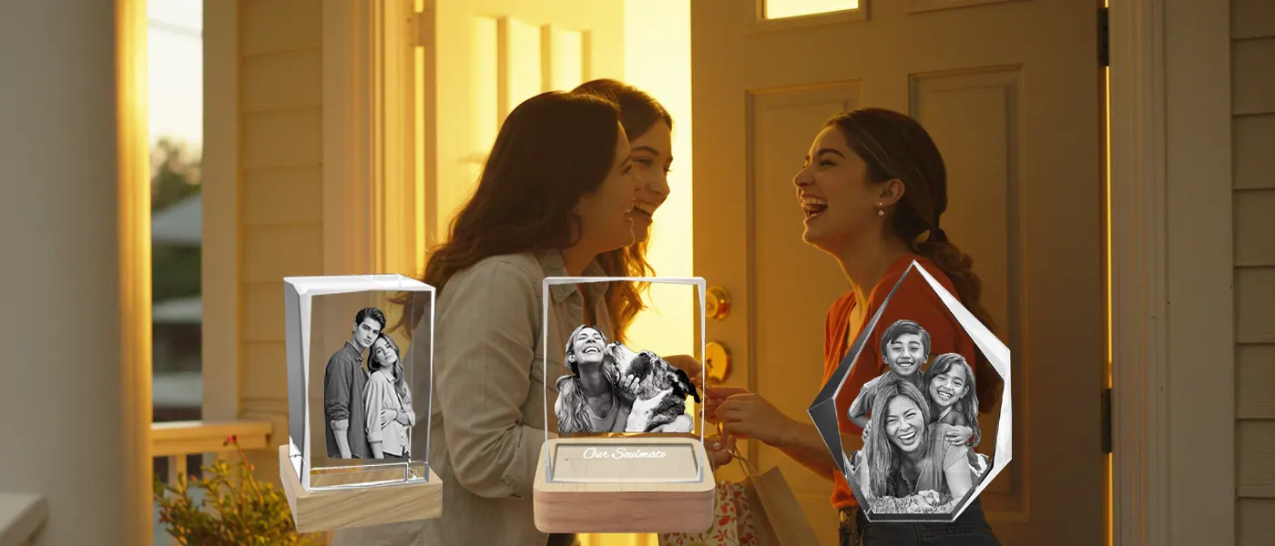 A joyful scene of three friends greeting each other at a sunlit doorway, with a foreground display of personalized 3D photo crystal gifts showcasing a couple, a pet owner, and a family, perfect for giving to a friend.