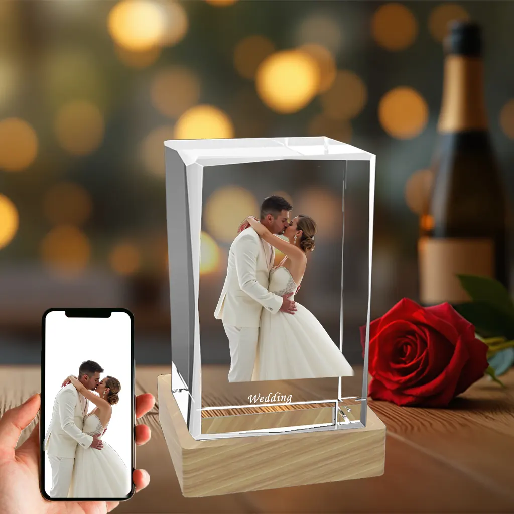 A rectangular 3D photo crystal block displaying an engraved image of a couple kissing on their wedding day, set on a wooden LED base, ideal as a wedding or anniversary gift.