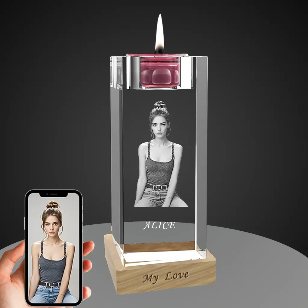 A personalized YiYues 3D crystal candle holder with a lit candle, featuring a custom photo of a woman 'Alice'. The lighted wooden base is engraved with 'My Love', and a smartphone shows the original photo.