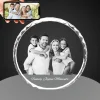 A personalized YiYues 3D Sunflower Crystal featuring a custom family photo and 'Family Joyous Moments' text, displayed in front of a smartphone showing the original color photo.