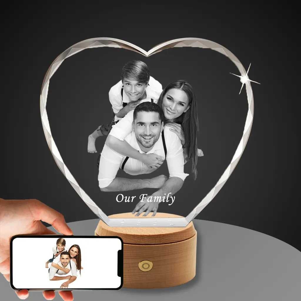 YiYues Personalized Faceted 3D Crystal Heart showcasing a joyous family portrait of parents and their son, with 'Our Family' engraved, on a classic wooden base.