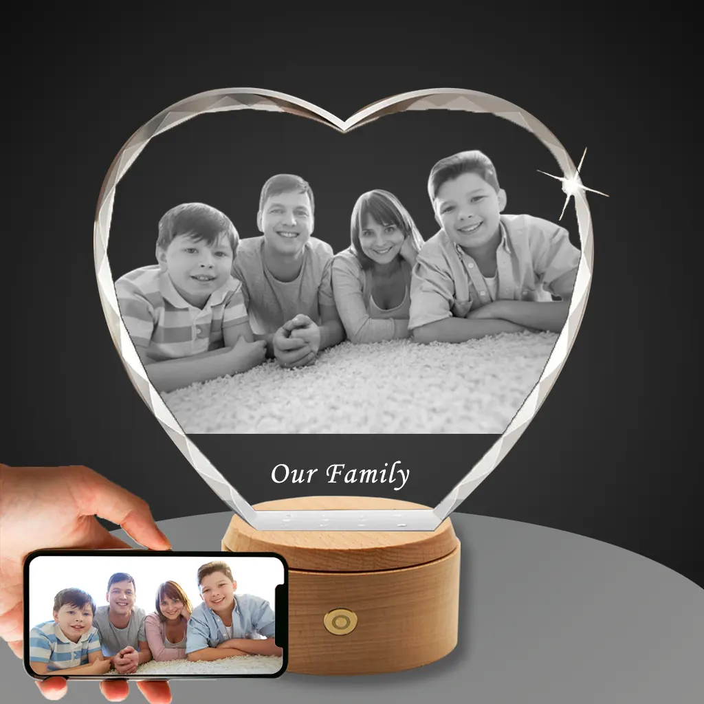 YiYues Personalized Faceted 3D Crystal Heart featuring a custom family portrait of parents with their two sons, with 'Our Family' engraved, on a classic wooden LED base.