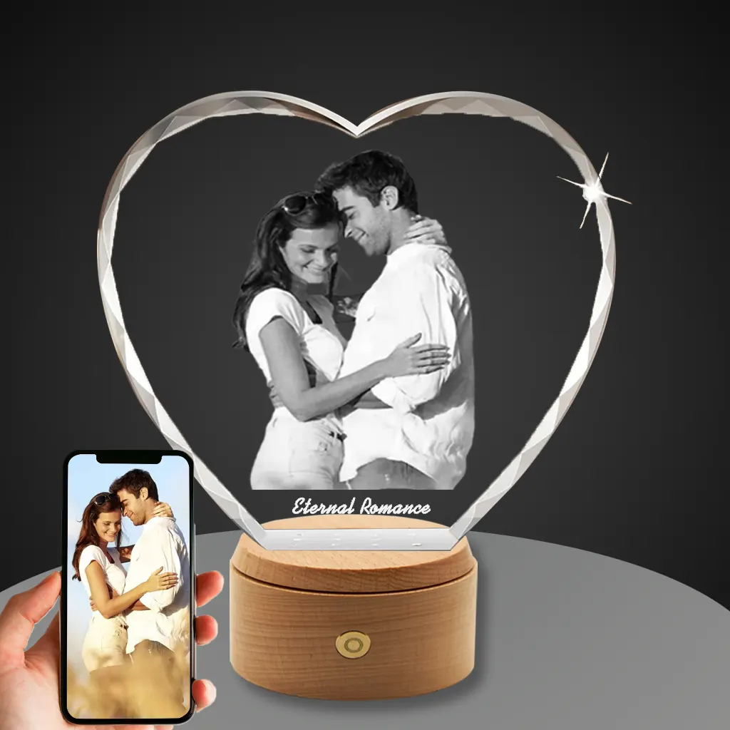 YiYues Personalized Faceted 3D Crystal Heart on a wooden LED base, featuring a custom photo of a couple and the engraving 'Eternal Romance'.